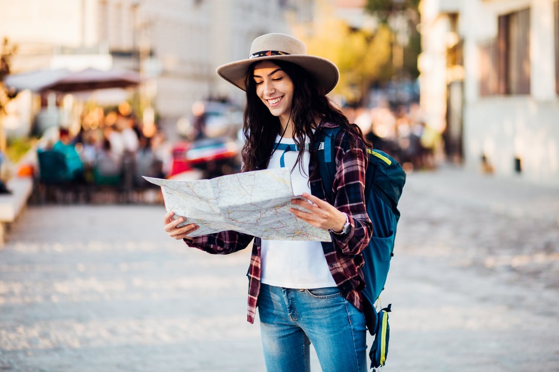 Girl on a solo trip exploring the city map